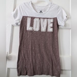 "Spread Love Everywhere You Go: Get Your 'Love' T-Shirt Today!"
